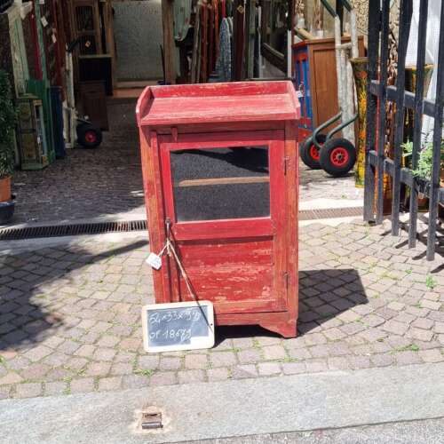 Mobiletto rosso con anta e vetro